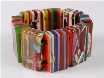 Lot 2767 - A banded and coloured lucite expanding...