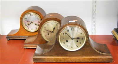Lot 24 - A 1930s oak cased mantel clock having a...