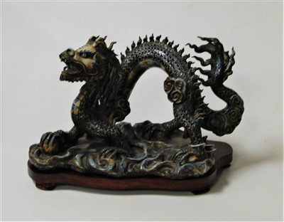 Lot 40 - A Chinese glazed stoneware figure of a four...