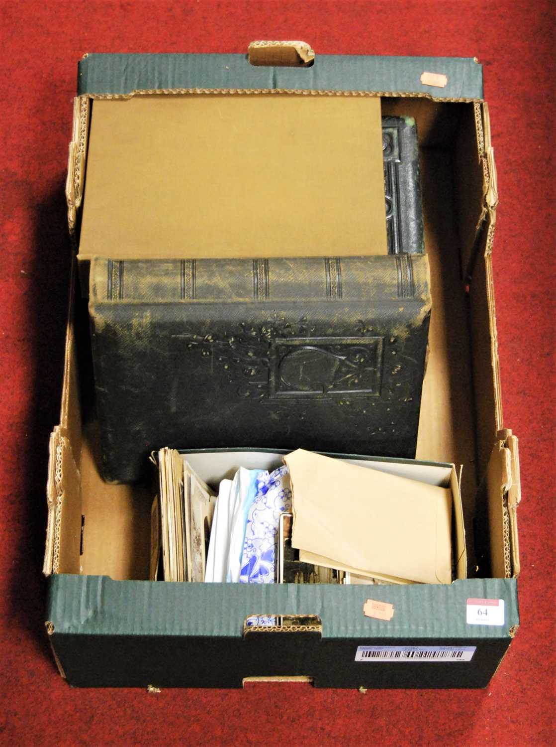 Lot 64 - A Victorian leather bound photo album,...