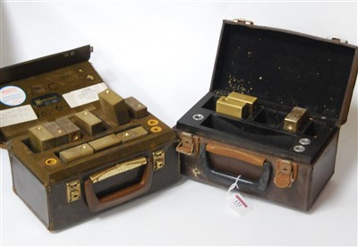 Lot 122 - Two leather cases containing various brass...