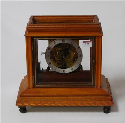 Lot 123 - A modern oak cased Anvil skeleton clock,...