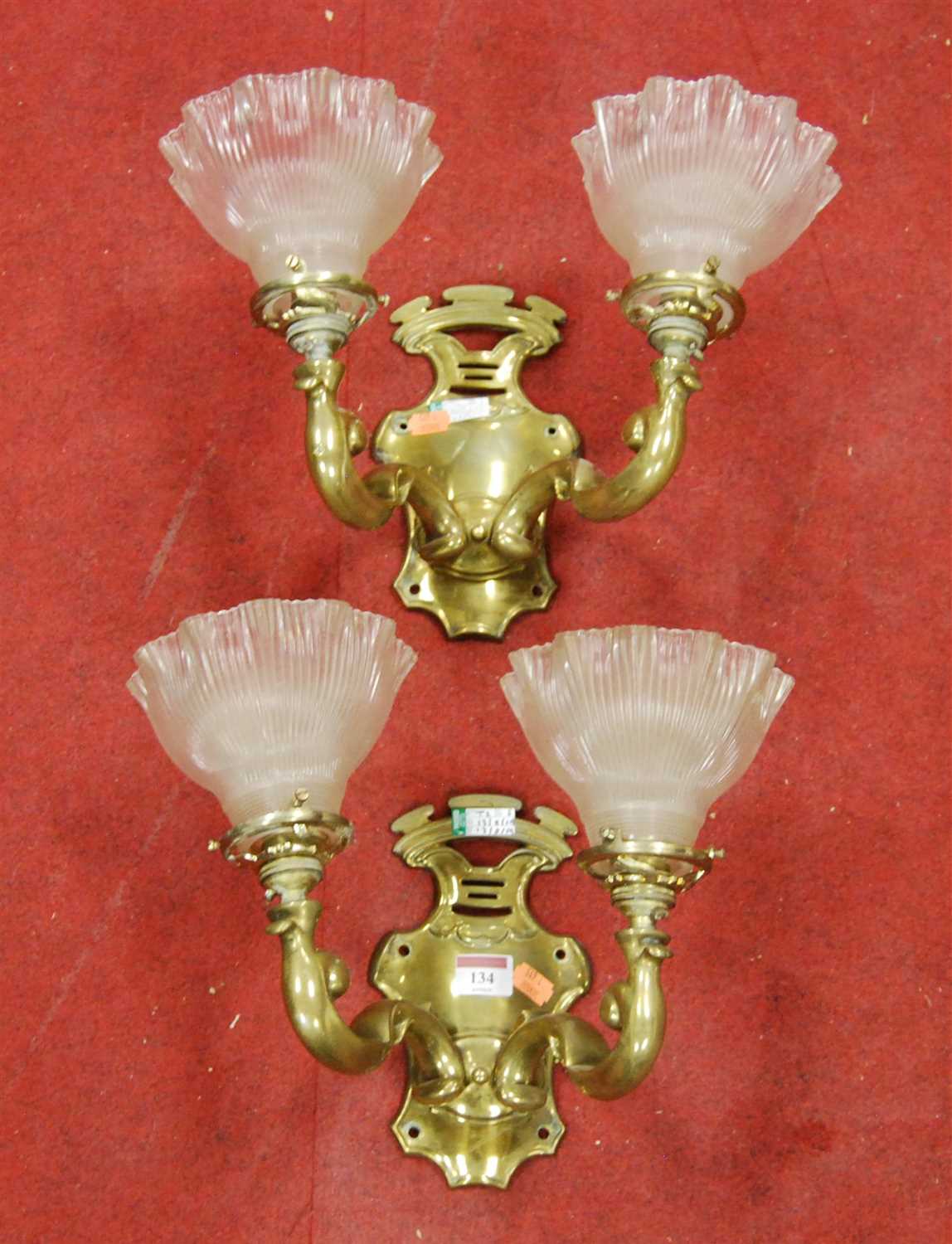 Lot 134 - A pair of brass twin sconce wall light...