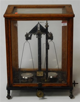 Lot 137 - A set of early 20th century oak cased chemists...