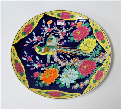 Lot 139 - A Chinese style charger, enamel decorated with...