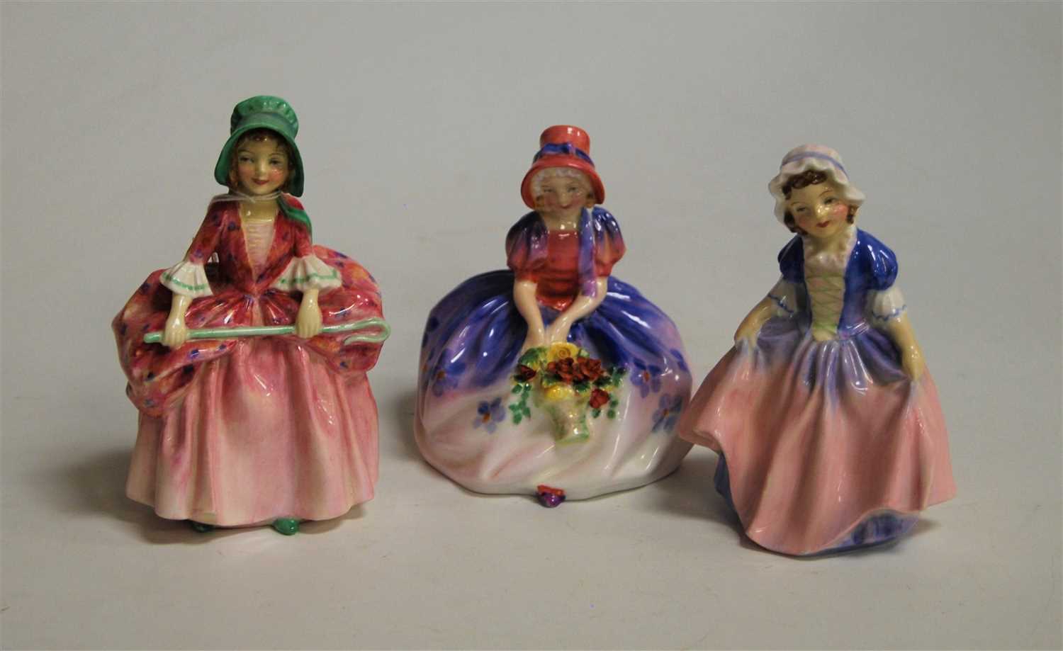 Lot 188 - Three Royal Doulton figurines, comprising...