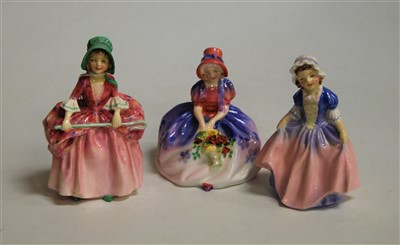 Lot 188 - Three Royal Doulton figurines, comprising...
