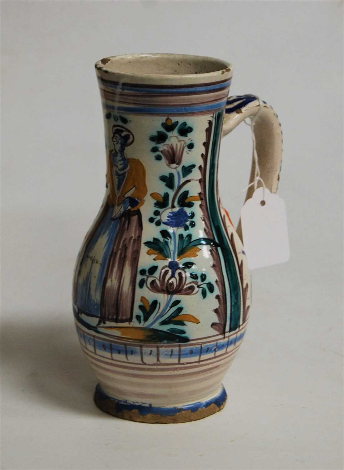 Lot 201 - A 19th century Dutch Delft jug, decorated with...