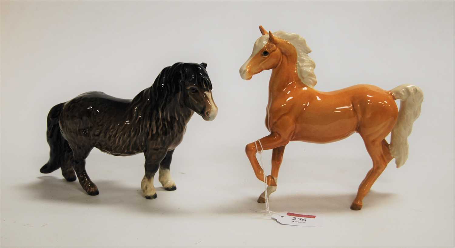 Lot 256 - A Beswick model of a Palamino pony, brown...
