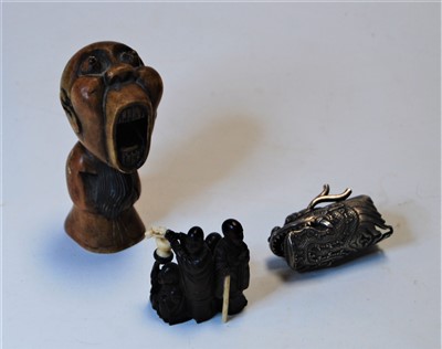 Lot 297 - A carved softwood netsuke, carved in the form...