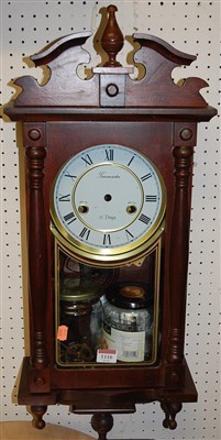 Lot 1116 - A reproduction mahogany droptrunk wall clock...