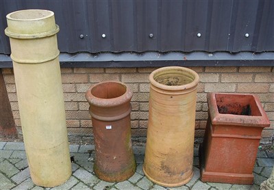 Lot 1128 - Four various terracotta chimney tops, the...