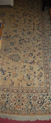Lot 1142 - A Persian woollen Tabriz rug, the stylised...