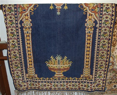 Lot 1151 - A Persian woollen blue ground rug, the central...