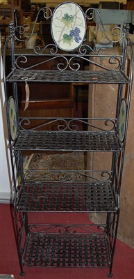 Lot 1154 - A contemporary black painted metal four-tier...