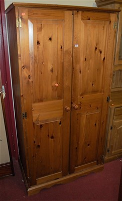 Lot 1160 - A modern pine double door wardrobe, w.95.5cm