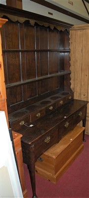 Lot 1168 - A 19th century oak dresser, having wavy cut...