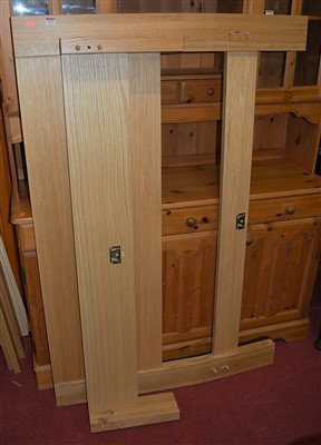 Lot 1171 - A contemporary light oak double bedstead,...