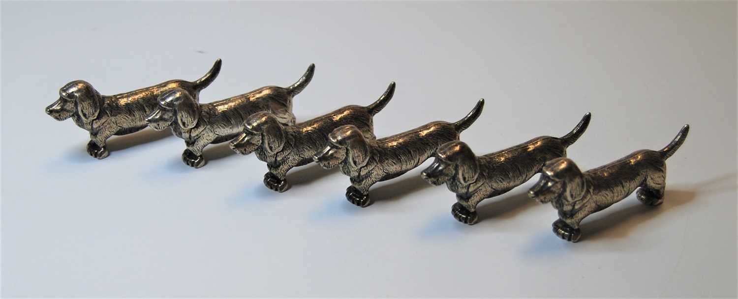 Lot 316 - A set of six silver plated knife rests, each...
