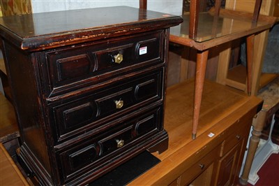 Lot 1199 - A small stained wood chest, of three long...