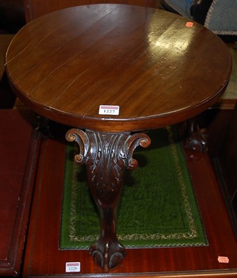 Lot 1227 - A circular mahogany low lamp table, raised on...