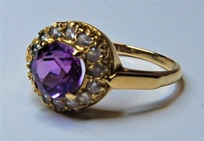 Lot 327 - A ladies 9ct gold and amethyst dress ring, the...