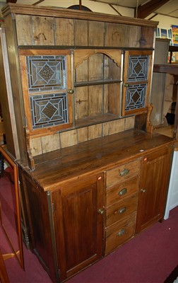 Lot 1236 - A rustic stained and planked pine kitchen...