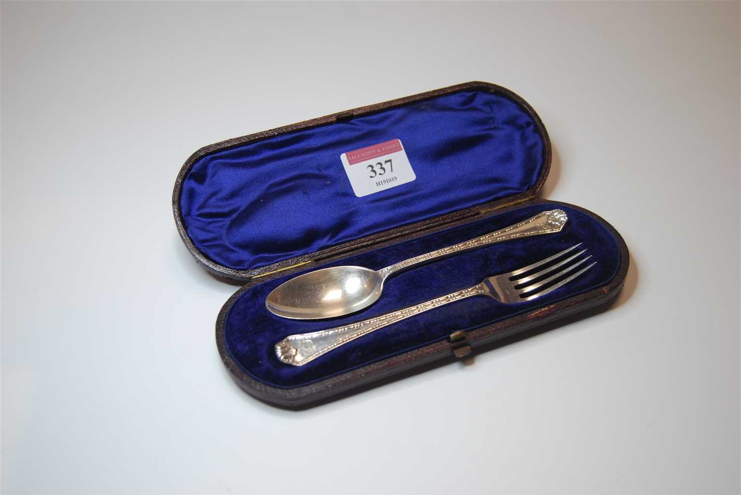 Lot 337 - A George V silver christening fork and spoon...
