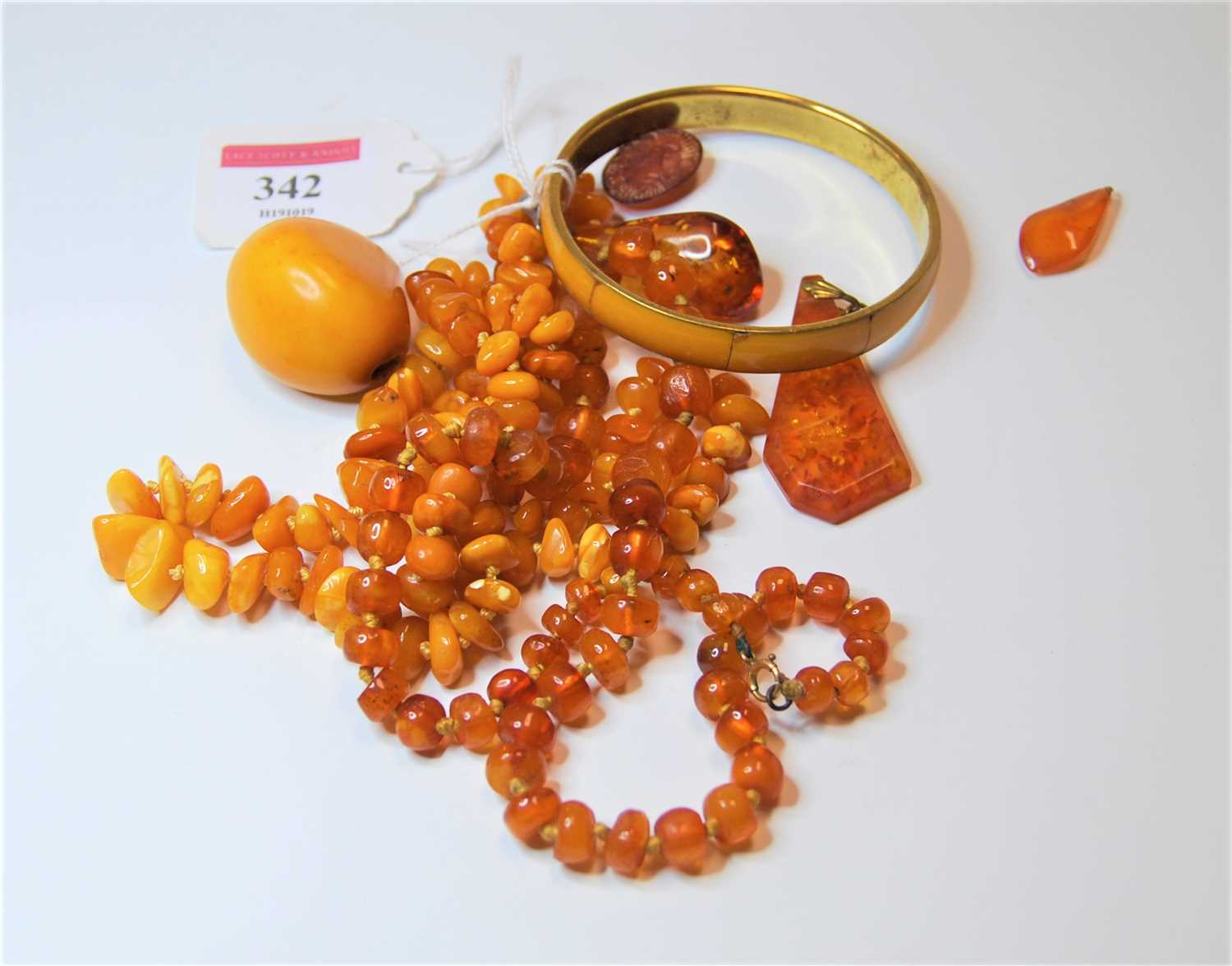 Lot 342 - A natural butterscotch amber style ladies...
