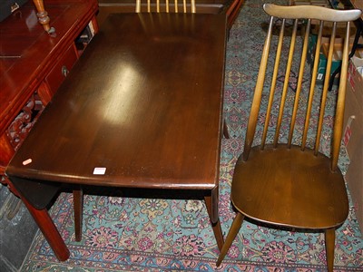 Lot 1266 - Two Ercol dark elm drop leaf dining tables...