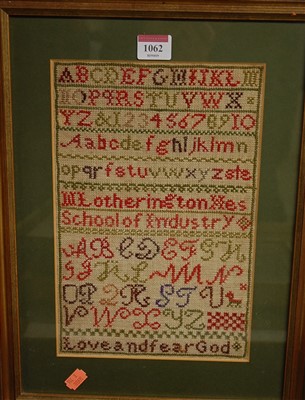 Lot 1062 - A needlework alphabet and word sampler, framed,...
