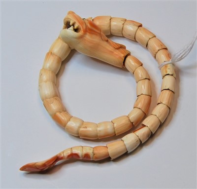 Lot 348 - An Angel Skin coral wraparound bracelet carved...