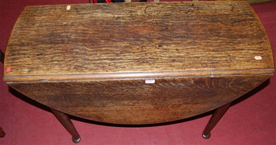 Lot 1297 - An early 19th century provincial oak drop leaf...