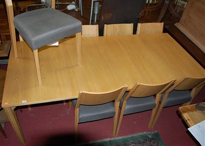 Lot 1305 - A contemporary Ercol Pinter light oak dining...