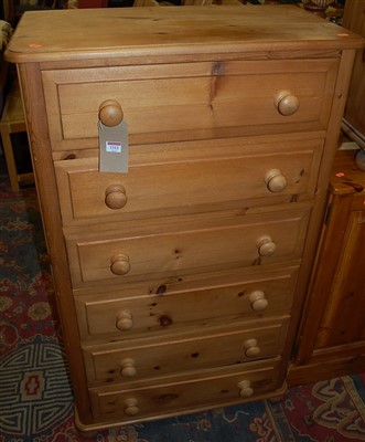 Lot 1313 - A modern pine round cornered narrow chest of...