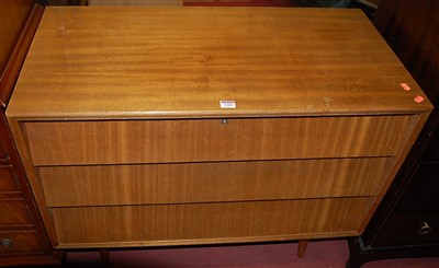 Lot 1385 - A 1960s English teak chest of three long...