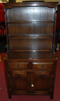 Lot 1387 - A small joined oak dresser, having two-tier...