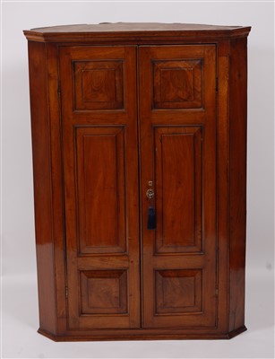 Lot 2536 - A George III walnut hanging corner cupboard,...