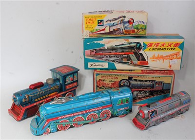 Lot 3246 - Three various boxed Japanese friction powered...