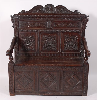 Lot 2490 - An antique carved and joined oak settle, circa...