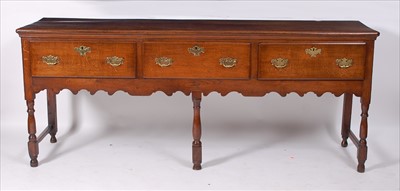 Lot 2492 - An oak dresser base in the Georgian style,...