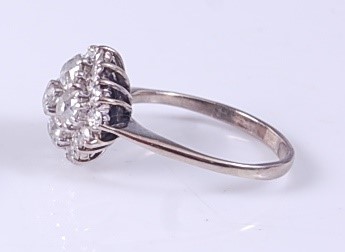 Lot 2118 - A white metal diamond circular cluster ring,...