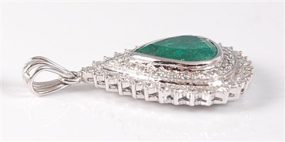 Lot 2148 - A white metal, emerald and diamond pear shaped...