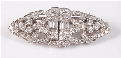 Lot 1189 - A white metal oblong Art Deco style diamond...