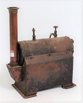 Lot 35 - An early 20th century model of a tin housed...