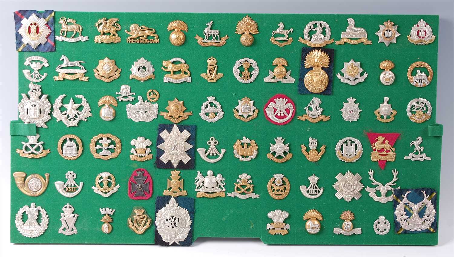 Lot 120 - A collection of British Army cap badges and insignia