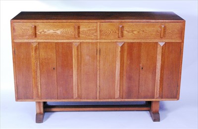 Lot 343 - An Art Deco oak sideboard, fitted with twin...