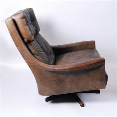 Lot 358 - A 1960s Danish tan leather upholstered swivel...