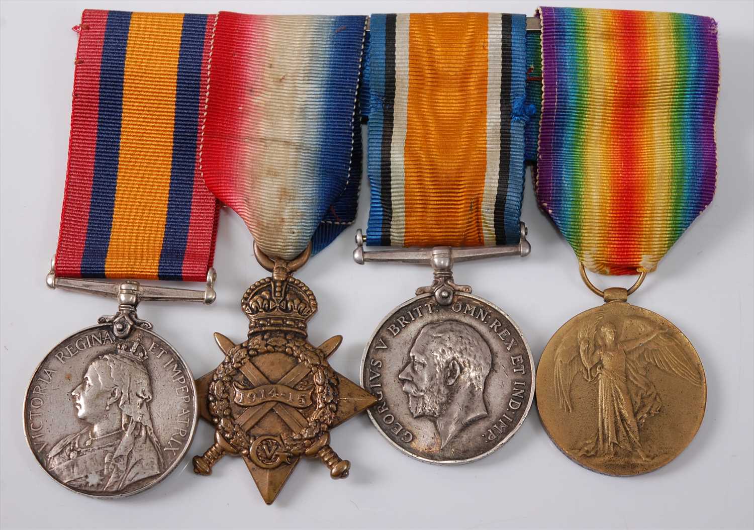 Lot 45 - A Victoria/George V group of four medals to include
