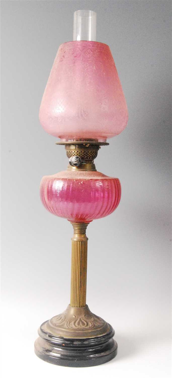 Lot 2282 - A Victorian brass pedestal oil lamp, having...